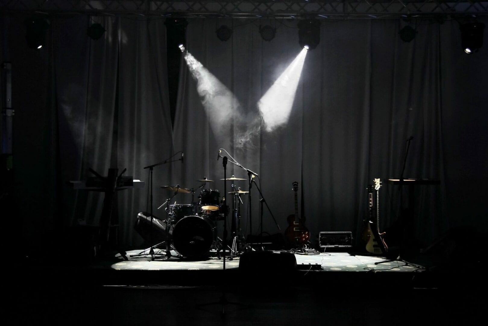 A stage with lights and drums on it