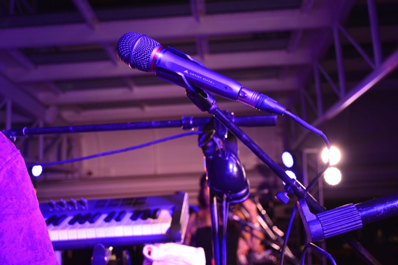 A microphone is on the stand in front of a stage.