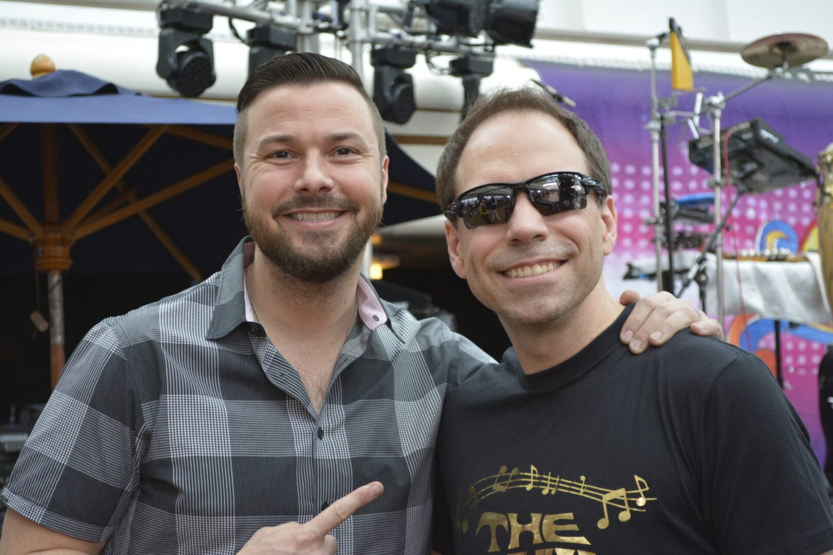 Two men posing for a picture at an event.