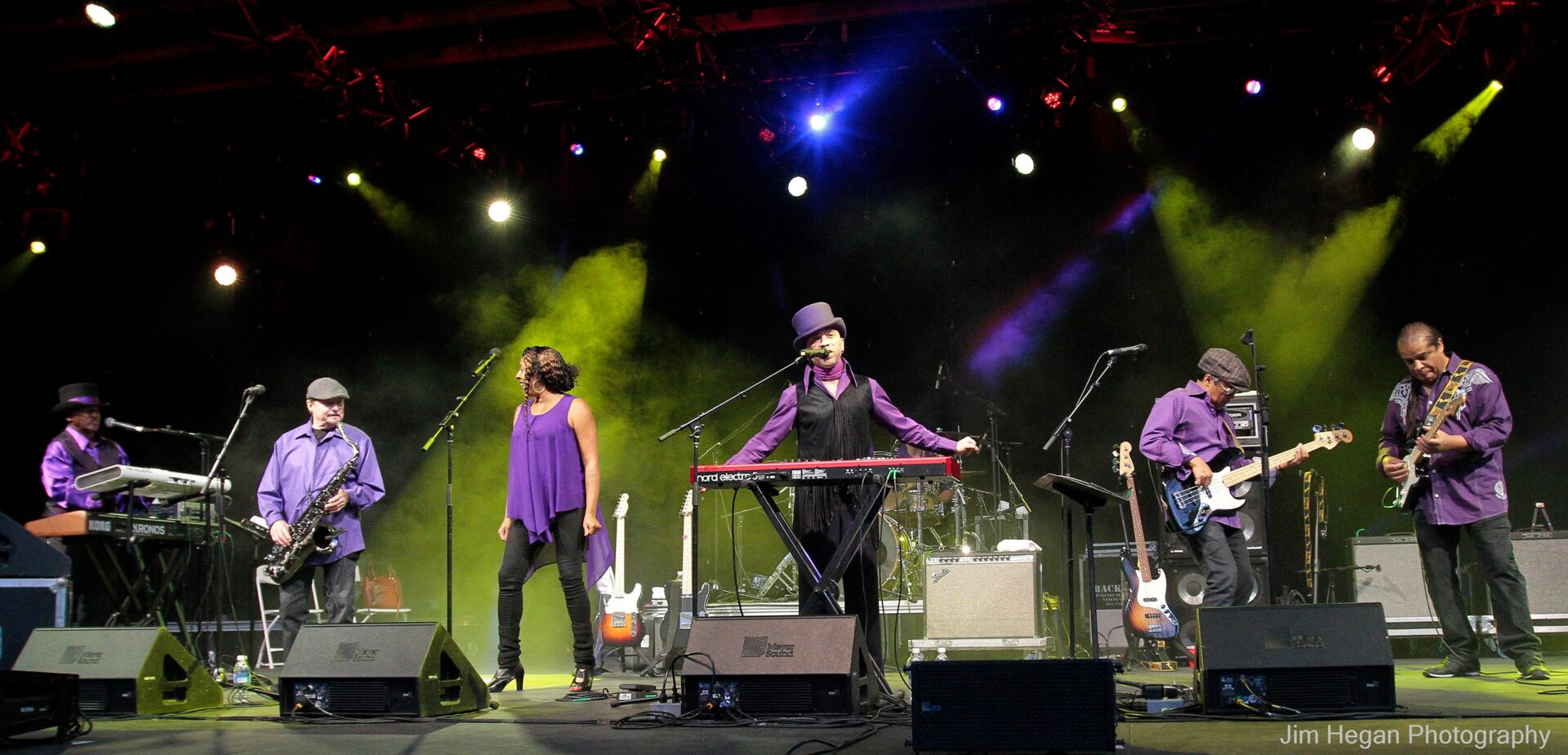 The Family Stone band performing on a stage together